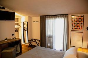 Posteľ alebo postele v izbe v ubytovaní MANTRA Suite&Rooms