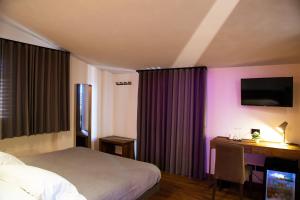 Posteľ alebo postele v izbe v ubytovaní MANTRA Suite&Rooms