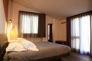 Posteľ alebo postele v izbe v ubytovaní MANTRA Suite&Rooms