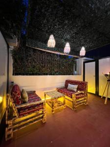 Posezení v ubytování Villa 3 Charme avec Vue sur Mer, Jacuzzi Privé, Face au Carrousel Mall Rabat
