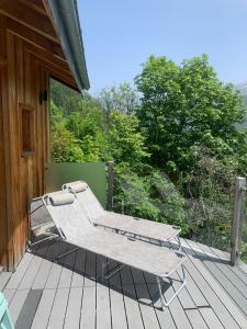 a pair of benches sitting on a deck at Mazot Hirondelle in Morzine +21 photos