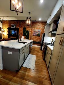 a kitchen with a sink and a counter top at Easy Access I TQL Stadium I Free Parking in Cincinnati
