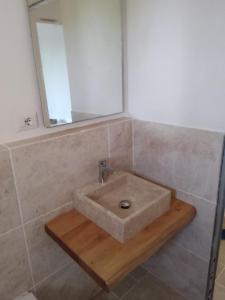 a bathroom with a sink and a mirror at I SALICI in Capoliveri