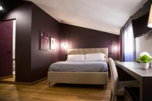 Postel nebo postele na pokoji v ubytování MANTRA Suite&Rooms