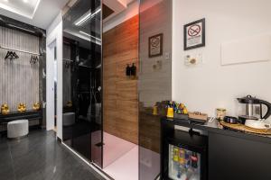 a kitchen with a counter and a glass wall at La Dimora Cuore & Passione in Naples +69 photos