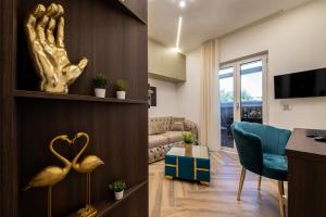a living room with a couch and a table and a living room at La Dimora Cuore & Passione in Naples