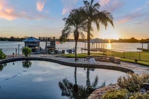 a swimming pool in the middle of a body of water at 5Br Sleeps 16 Private Pool-Dog Friendly-Fire Pit in Lake Placid +66 photos