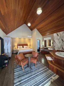 Postel nebo postele na pokoji v ubytování Chalés e Pousada - Centro Histórico - By Pousada Pricesa Isabel