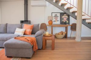 a living room with a couch and a table at Just Like Home - Casa Cesário in Vila Praia de Âncora +38 photos