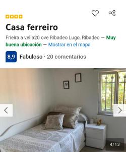 a bedroom with a bed and a window at Casa ferreiro in Ribadeo