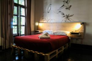 Cama ou camas em um quarto em Hostel Boutique Merced 88
