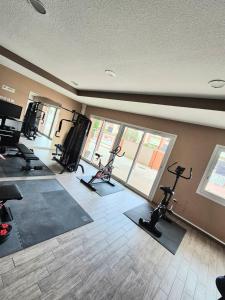a gym with bikes and exercise equipment in a room at Apartment 4-6 personnes avec Piscine Demeure De la Massane in Argelès-sur-Mer