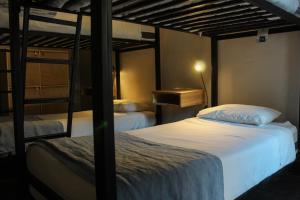 Cama ou camas em um quarto em Hostel Boutique Merced 88