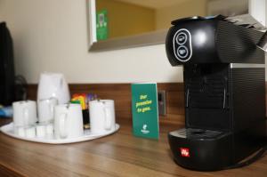a camera sitting on top of a counter with cups at Holiday Inn Brighton Seafront by IHG in Brighton & Hove