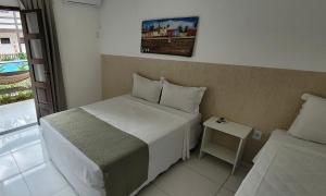 Postel nebo postele na pokoji v ubytování Hotel Malibu + 25 fotografií