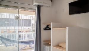 TV a/nebo společenská místnost v ubytování Hotel Malibu