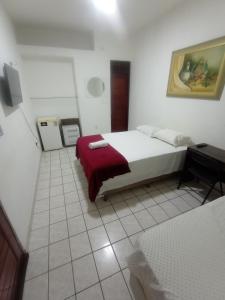 Postel nebo postele na pokoji v ubytování Pousada Maria Bonita - Centro, 10min da Praia de Camapum, Macau RN