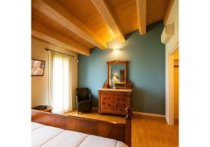Postel nebo postele na pokoji v ubytování Agriturismo Trerè
