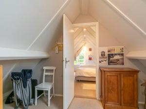 Katil atau katil-katil dalam bilik di Family Home Sint Maartenszee near Beach