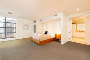 a bedroom with a bed and a large window at Stunning Panoramic Ocean Views Penthouse Hot Tub in Manhattan Beach