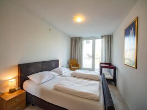 Ένα ή περισσότερα κρεβάτια σε δωμάτιο στο Apartment in Groote Keeten near the Beach +32 φωτογραφίες