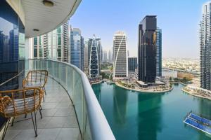 a balcony with a view of a river in a city at Elegant Haven and Spacious 2BR in Lake Terrace in Dubai