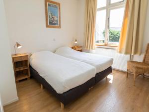 Ένα ή περισσότερα κρεβάτια σε δωμάτιο στο Apartment in De Koog near Texel Beach
