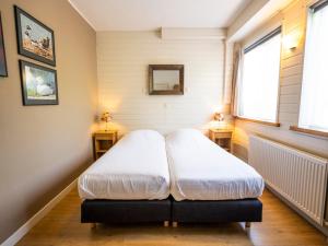 Ένα ή περισσότερα κρεβάτια σε δωμάτιο στο Apartment in De Koog near Texel Beach
