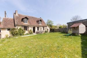an old house with a grass yard in front of it at Sweet cottage 1 hr 40 min from Paris in Béthonvilliers