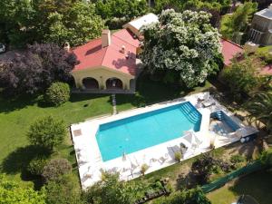 an aerial view of a house with a swimming pool at La Masia in Chacras de Coria