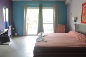 Postel nebo postele na pokoji v ubytování Hotel L'ebene Verte