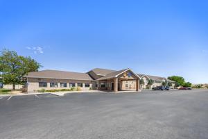 a large office building with a parking lot at Comfort Inn Grand Junction I-70 in Grand Junction