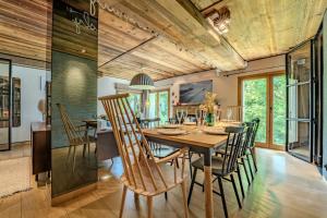 a dining room with a table and chairs at Stylish 3BR Apartment with Mountain View - 8 Guests, Rochebrune, Megève in Megève