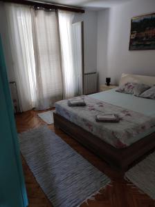 Ένα ή περισσότερα κρεβάτια σε δωμάτιο στο Apartment Cvita