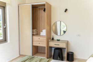 a dressing room with a mirror and a desk at Maera Apartments in Sami +146 photos