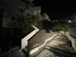 a staircase leading to a building at night at Casa Vacanze Tortora in Tortora