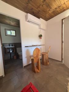 a room with a table and two chairs in it at In da House - Adults Only - TI in Molinari