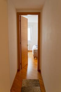 an open door to a room with a bed at Aylin Apartman in Sarajevo +9 photos