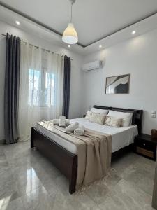 Postel nebo postele na pokoji v ubytování Korithis Apartment