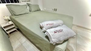 Katil atau katil-katil dalam bilik di Casa de temporada - Pinheiro