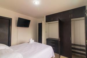 Postel nebo postele na pokoji v ubytování Casa Amplia, Piscina privada, Vía Samborondón, parrilla