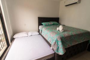 Postel nebo postele na pokoji v ubytování Casa Amplia, Piscina privada, Vía Samborondón, parrilla
