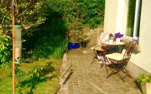 a table and chairs sitting on a brick patio at Mole End Bed and Breakfast in Llangwm