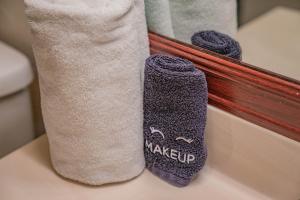 a pair of socks sitting next to a towel at 4BR - Arcades, Putting Green, Fire Pit, Themed Rooms in Glendale +60 photos