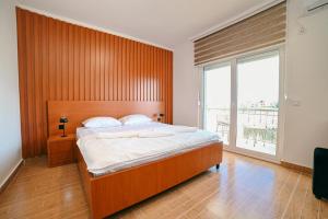 Ένα ή περισσότερα κρεβάτια σε δωμάτιο στο Hotel Ariana Lux