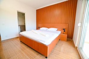 Ένα ή περισσότερα κρεβάτια σε δωμάτιο στο Hotel Ariana Lux
