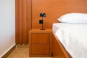 Ένα ή περισσότερα κρεβάτια σε δωμάτιο στο Hotel Ariana Lux