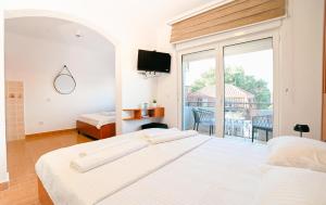 Ένα ή περισσότερα κρεβάτια σε δωμάτιο στο Hotel Ariana Lux