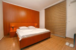 Ένα ή περισσότερα κρεβάτια σε δωμάτιο στο Hotel Ariana Lux