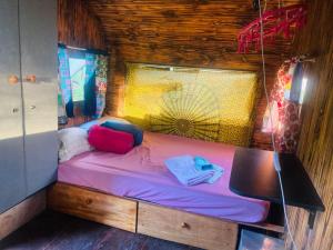 Ένα ή περισσότερα κρεβάτια σε δωμάτιο στο Sítio Agroecológico Ecovila Sustentar